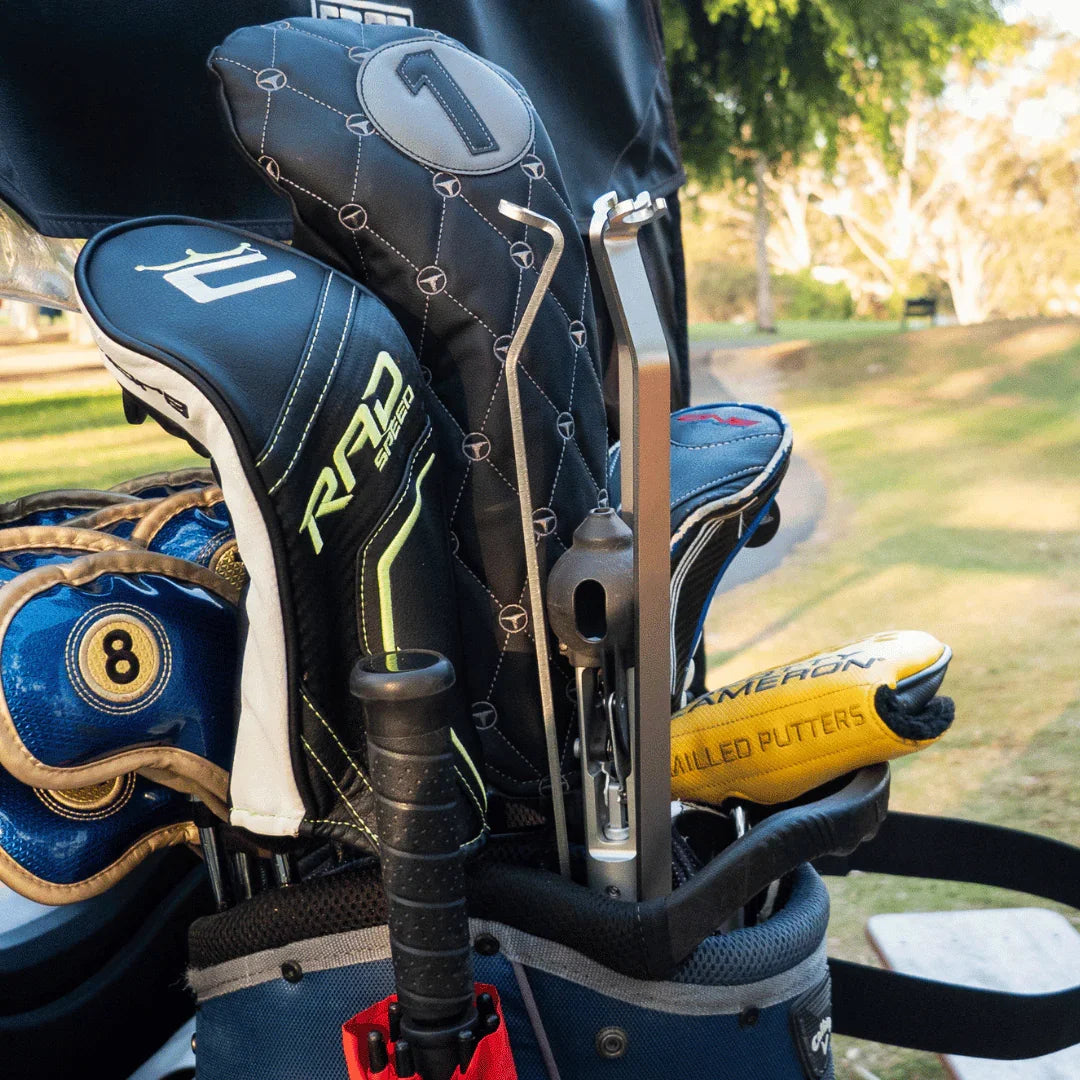Close up of T-UP Assist golf teeing aid in a Golf Bag with tripod closed